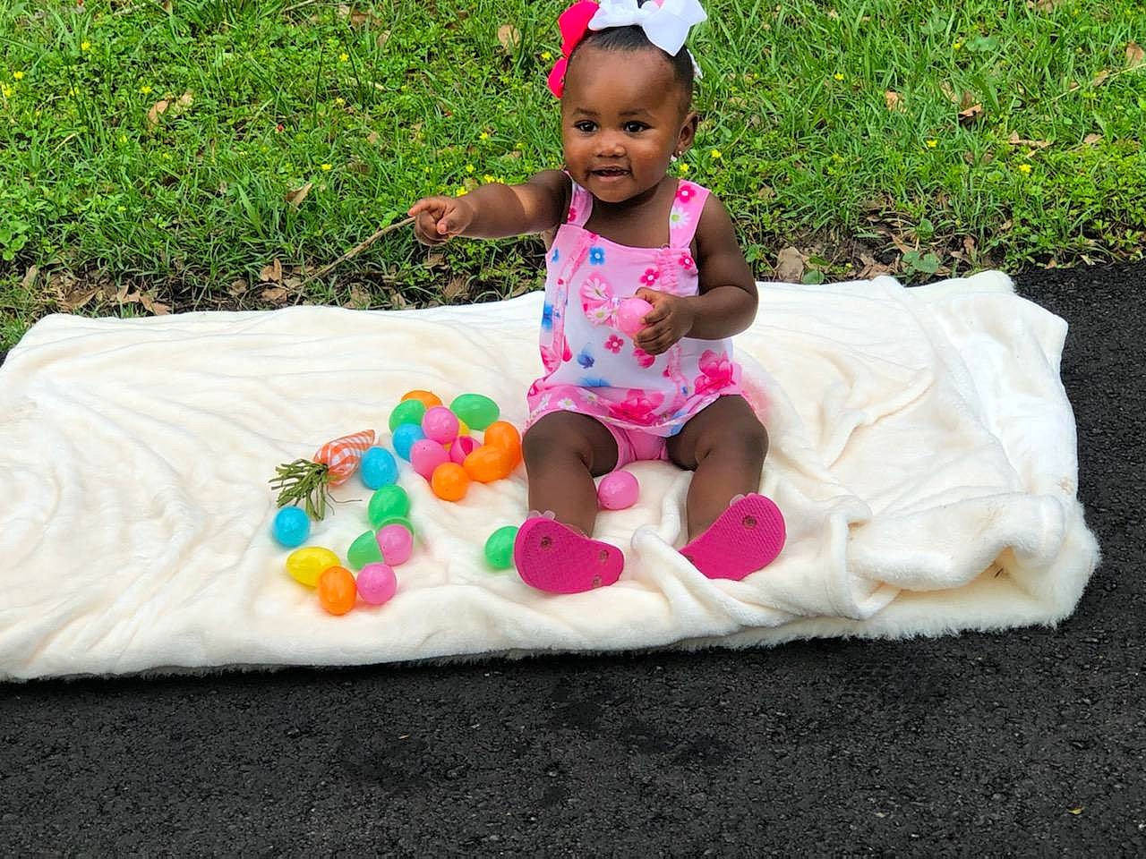 Rhythm joined the competition — help win amazing prizes! baby, baby_toddler_clothing, child, dress, event, face, fun, grass, happy, head, leisure, magenta, person, pink, plant, recreation, sitting, sleeve, smile, t_shirt