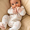 adorable, baby, beige, child, comfort, couch, cozy, cute, feet, hands, indoors, infant, leather, pajamas, portrait, rainbow_pattern, relaxing, small_person, soft_lighting, wide_eyes