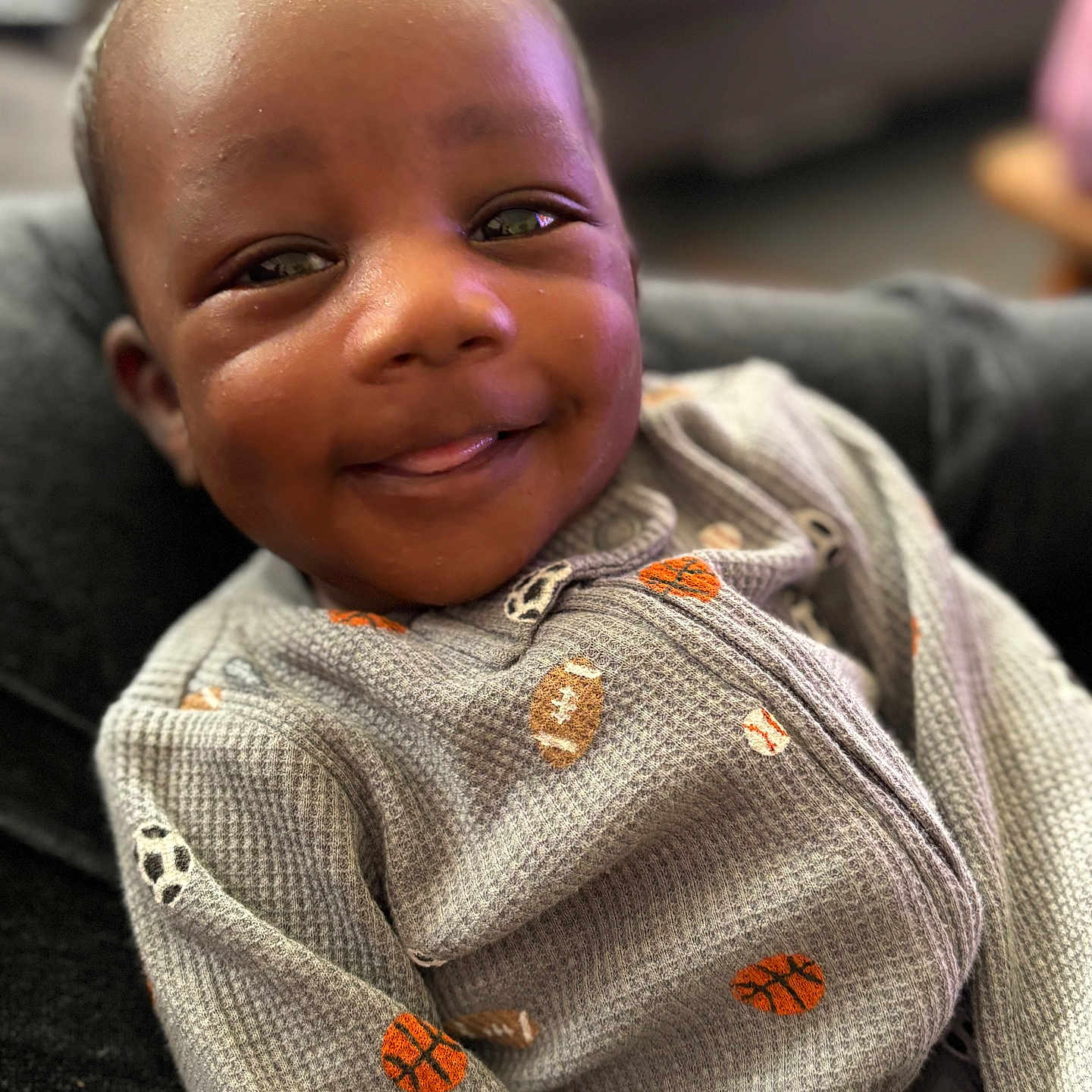 Ziovanni joined the competition — help win amazing prizes! baby, babylaughing, bodypart, clothing, coat, couch, face, finger, furniture, hand, happy, head, jacket, knitwear, person, photography, portrait, smile, sweater, sweatshirt