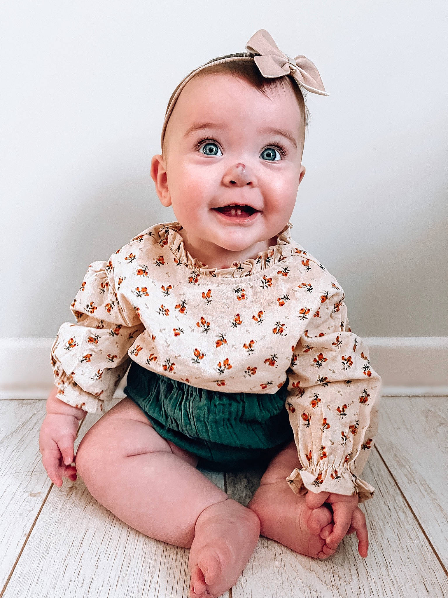Hali is registered to the contest to win money with this photo: baby, baby_toddler_clothing, cheek, child, collar, dress, eye, face, flash_photography, flooring, happy, head, neck, pattern, person, pink, skin, sleeve, smile, toddler