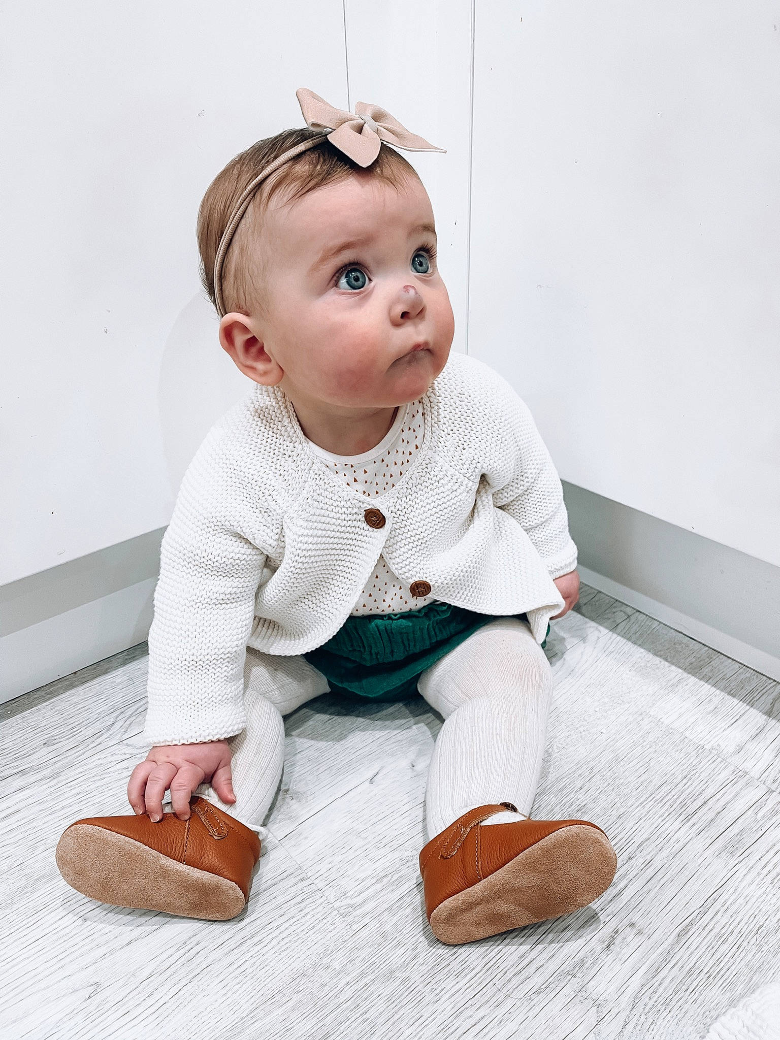 Hali joined the competition — help win amazing prizes! arm, baby, baby_toddler_clothing, cheek, child, collar, dress_shirt, eye, floor, flooring, foot, happy, human_leg, knee, leg, person, sitting, skin, sleeve, surprise