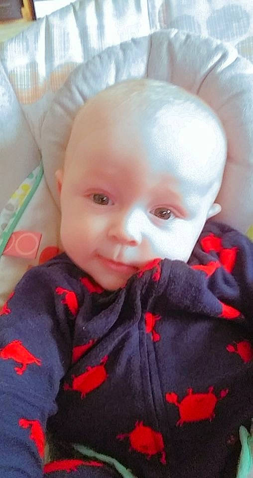 Wyatt is registered to the contest to win money with this photo: baby, baby_toddler_clothing, cheek, child, chin, eye, eyebrow, forehead, headgear, iris, lip, mouth, nose, orange, outerwear, person, skin, sleeve, textile, toddler