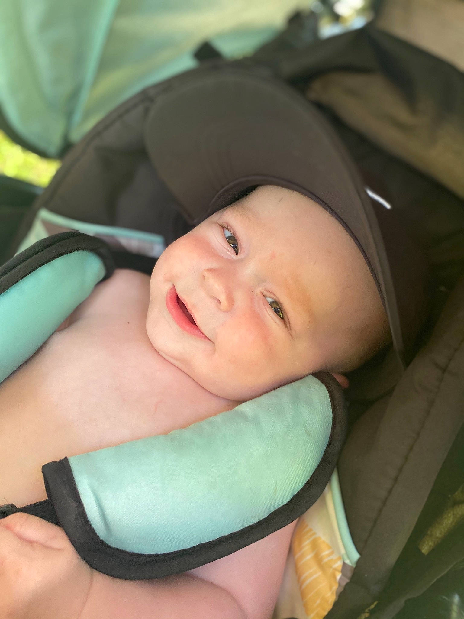 Wyatt is registered to the contest to win money with this photo: baby, baby_carriage, baby_products, black, cheek, comfort, electric_blue, eyebrow, eyelash, fashion_accessory, finger, gesture, happy, hat, headwear, human_body, iris, joy, person, skin