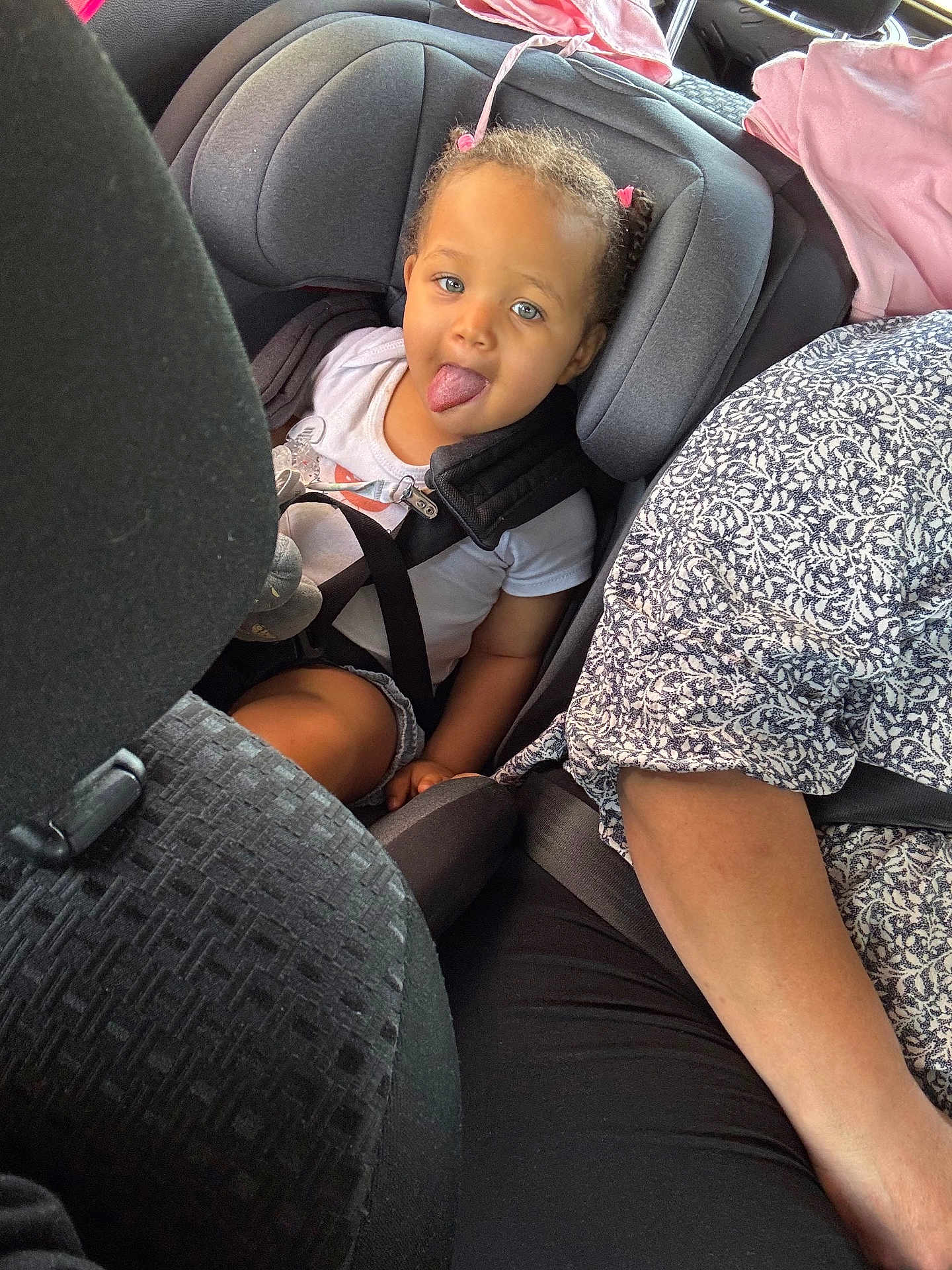 Kaelynn participe au concours pour gagner de l'argent avec cette photo : toddler, child, car_seat, car, seat_belt, tongue_out, playful, interior, person, clothing, hair, seat, safety, travel, cute, young_child, infant, restraint, patterned_shirt, casual