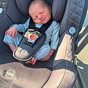 Rylie joined the competition — help win amazing prizes! newborn, baby, car_seat, gray, infant, child, seatbelt, sitting, outdoor, sunlight, expression, face, clothing, sleepsuit, safety, transport, head_support, tiny, cute, portrait