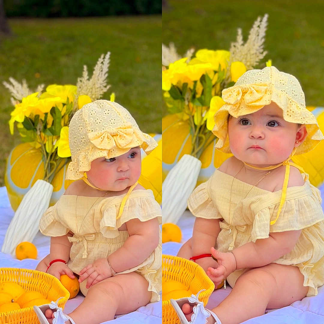 Madisson is registered to the contest to win money with this photo: baby, child, yellow_hat, yellow_dress, blanket, outdoor, flowers, basket, oranges, sitting, cute, sunny, grass, nature, portrait, summer, garden, footwear, headwear, expression
