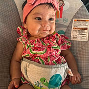 Henesey joined the competition — help win amazing prizes! baby, child, infant, pink_bow, headband, watermelon_pattern, baby_seat, safety_warning, animal_illustration, sun_illustration, clothing, cute, smile, face, hand, legs, indoor, portrait, seat, colorful