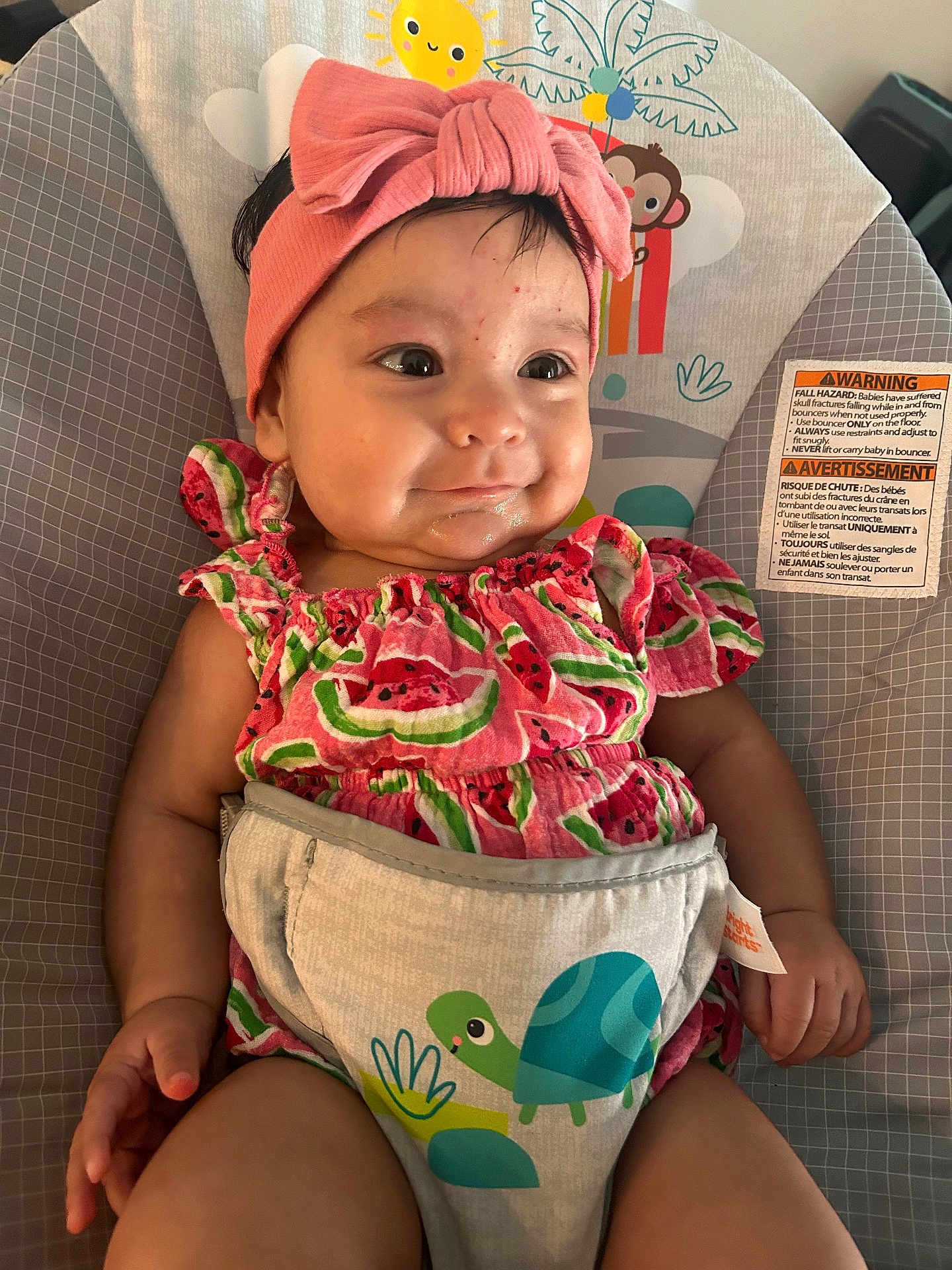 Henesey joined the competition — help win amazing prizes! baby, child, infant, pink_bow, headband, watermelon_pattern, baby_seat, safety_warning, animal_illustration, sun_illustration, clothing, cute, smile, face, hand, legs, indoor, portrait, seat, colorful