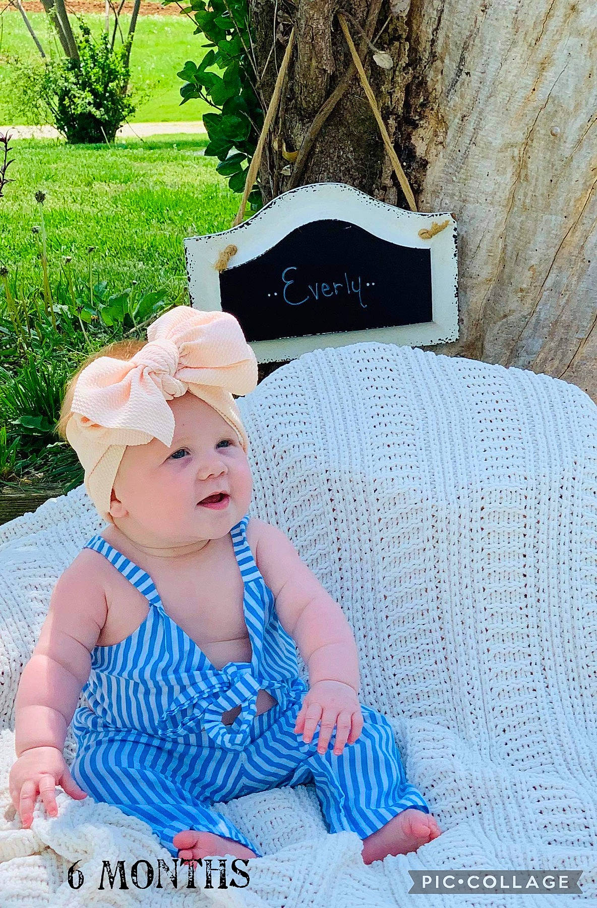Everly joined the competition — help win amazing prizes! baby, baby_toddler_clothing, child, electric_blue, fashion_accessory, grass, green, happy, headband, headgear, headpiece, headwear, jewellery, leisure, pattern, person, plant, recreation, sitting, textile
