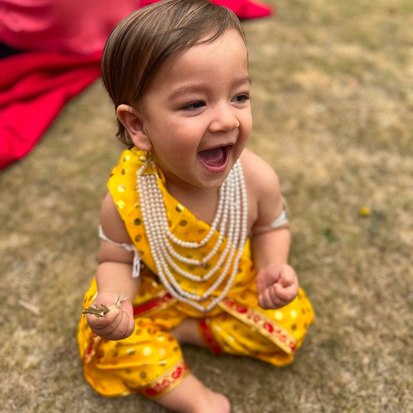 Nirvair is registered to the contest to win money with this photo: barefoot, child, cute, daylight, face, grass, hands, happy, joyful, laughing, nature, outdoor, pearls, playful, sitting, smiling, toddler, traditional_dress, yellow_clothing, young_child