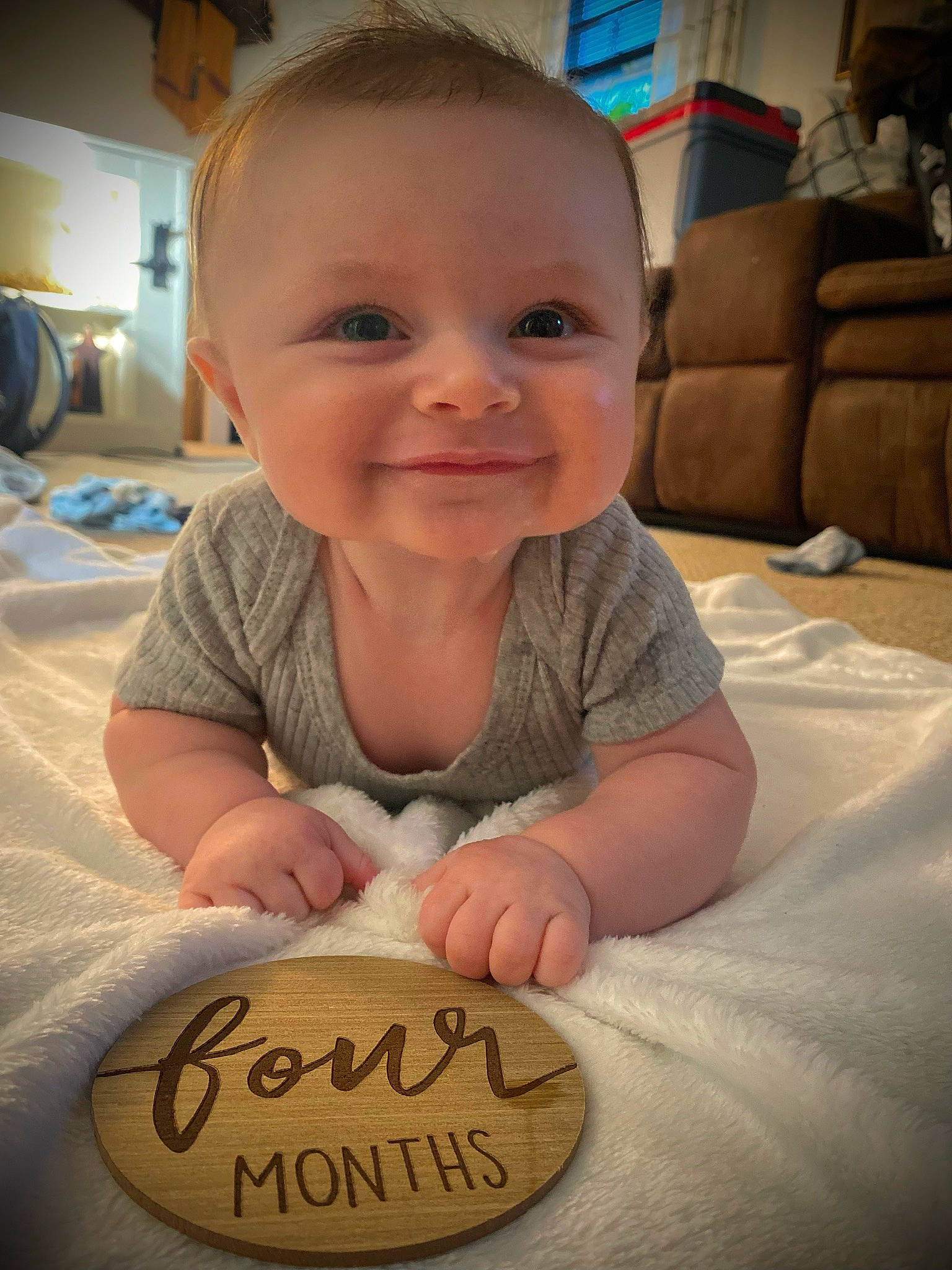 Jesse is registered to the contest to win money with this photo: arm, baby, cheek, chin, comfort, eye, finger, flooring, gesture, hand, happy, head, joy, mammal, mouth, nose, person, skin, smile, thumb