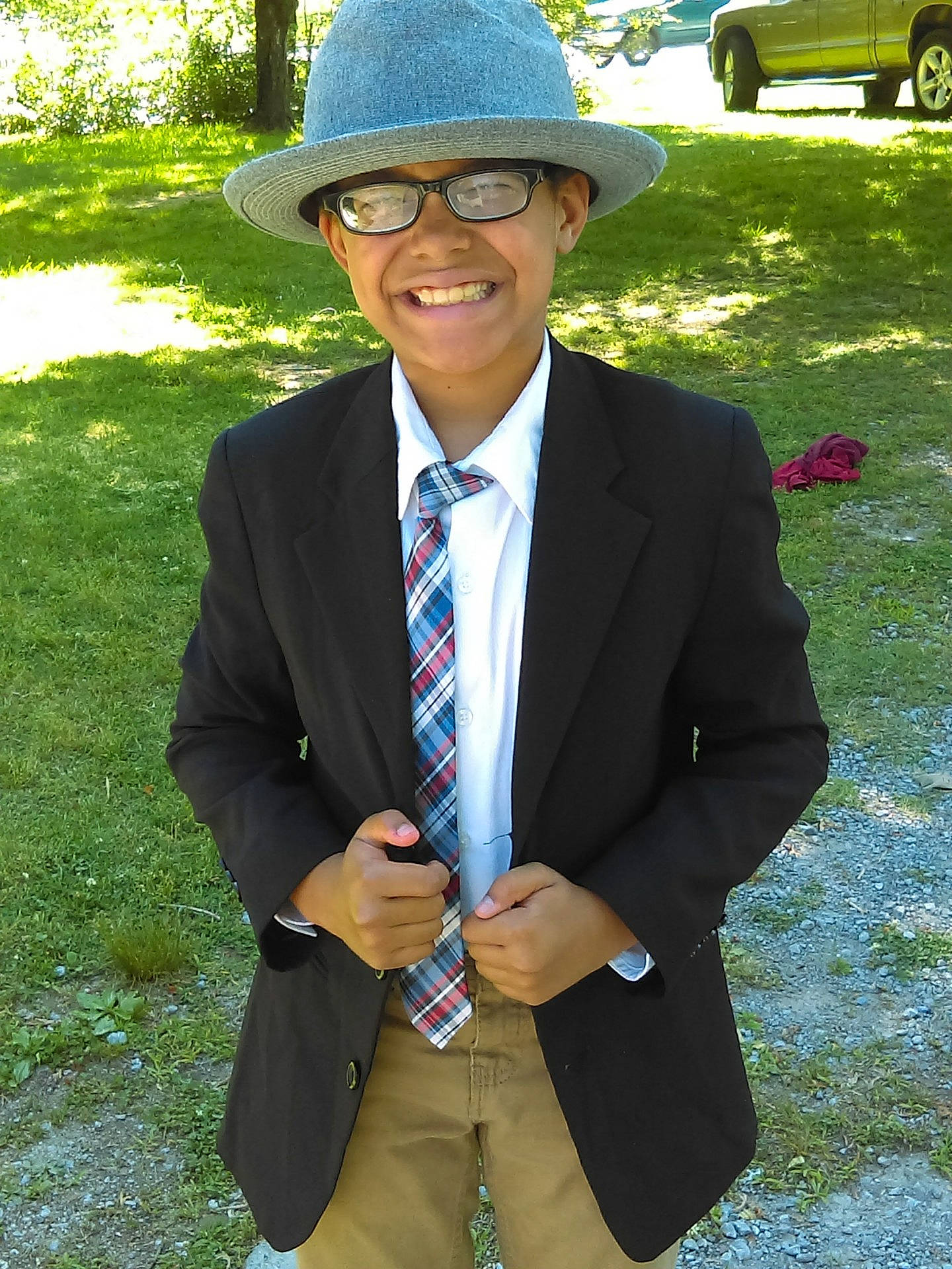 Chandler is registered to the contest to win money with this photo: blazer, clothing, cool, fashion_accessory, fedora, formal_wear, fun, gentleman, glasses, hat, headgear, headwear, joy, necktie, outerwear, person, smile, suit, sunglasses, tuxedo