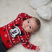 Swann participe au concours pour gagner de l'argent avec cette photo : baby, child, mickey_mouse, red_sweater, plush_toy, teddy_bear, white_rug, cute, indoor, portrait, infant, clothing, holiday_theme, soft_texture, lying_down, casual, young_child, smiling, cozy, comfortable