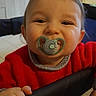 Tyam participe au concours pour gagner de l'argent avec cette photo : baby, child, childhood, cozy, cute, face, furniture, hand, happy, holding, home, indoor, infant, pacifier, person, playpen, red_sweater, smile, toy_car, young_child
