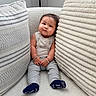 baby, child, clothing, comfortable, couch, cozy, cushion, cute, expression, fabric, furniture, home, indoor, infant, person, pillow, plush, portrait, sitting, socks