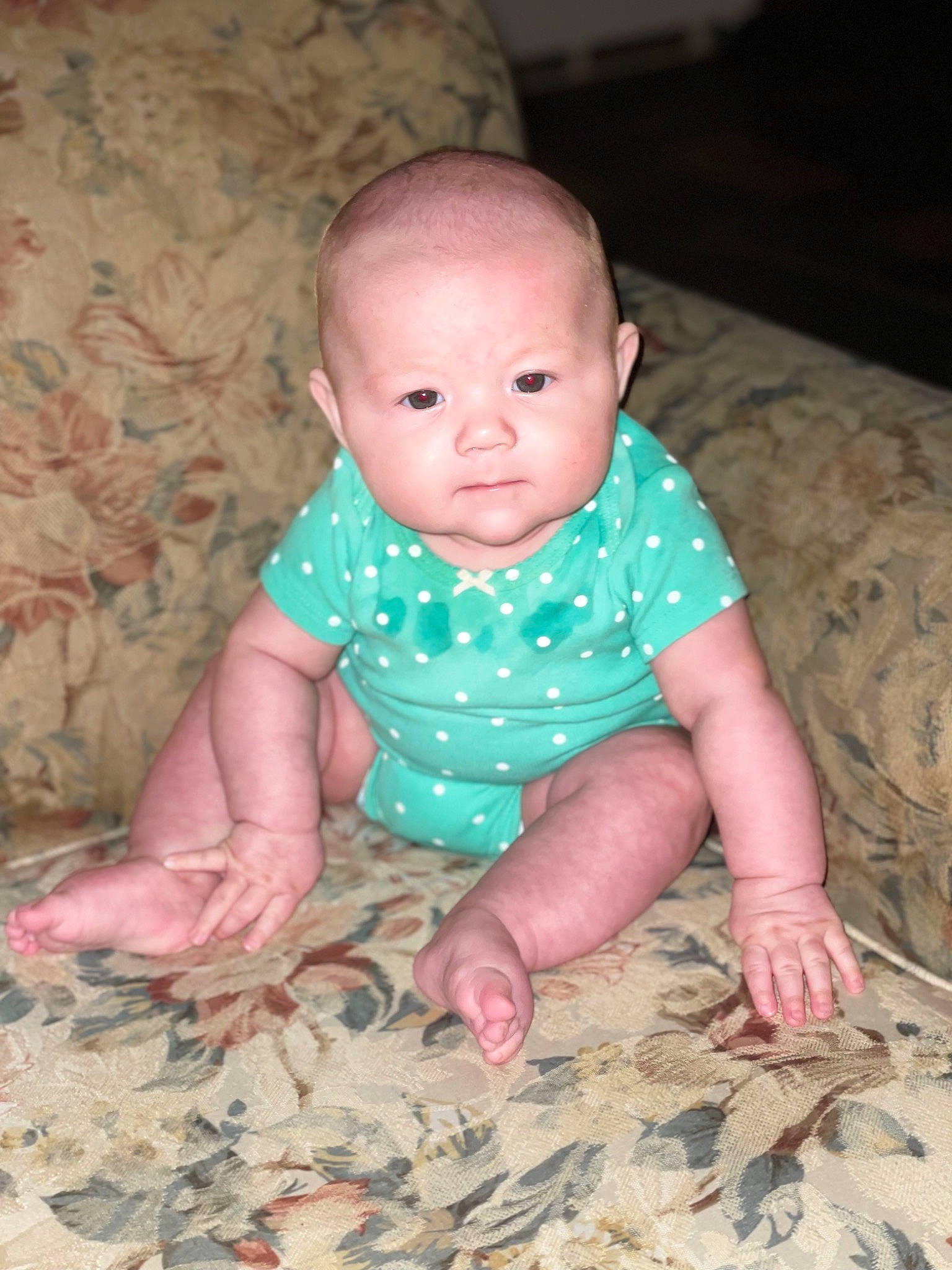 Serenity is registered to the contest to win money with this photo: arm, baby, baby_toddler_clothing, cheek, chin, clothing, comfort, eye, finger, head, human_body, iris, leg, mouth, neck, nose, person, skin, sleeve, textile