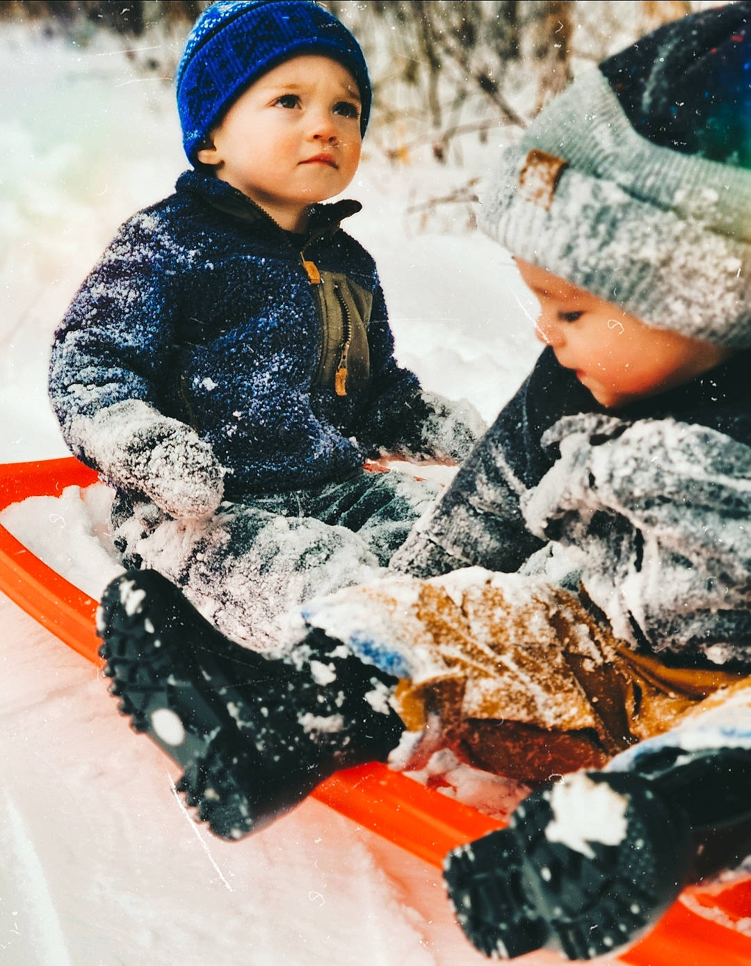 Landry joined the competition — help win amazing prizes! baby_toddler_clothing, beanie, bonnet, cheek, child, freezing, frost, headgear, headwear, hood, knit_cap, nose, person, play, playing_in_the_snow, precipitation, sled, sledding, snow, toddler