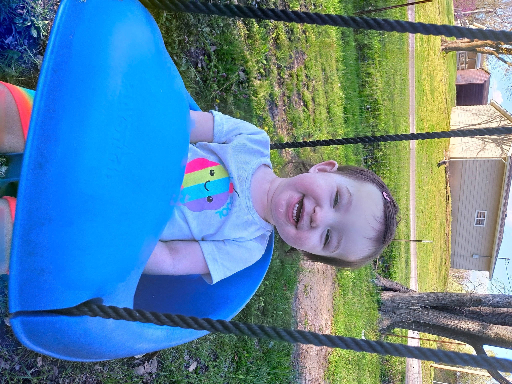 Lillian joined the competition — help win amazing prizes! automotive_wheel_system, child, electric_blue, fun, grass, happy, joy, leaf, leisure, outdoor_play_equipment, people_in_nature, person, plant, plastic, play, recreation, smile, t_shirt, toddler, tree