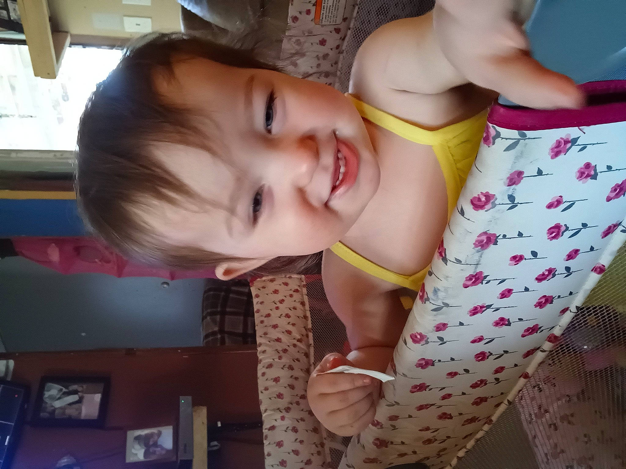 Lillian is registered to the contest to win money with this photo: abdomen, baby, baby_products, baby_toddler_clothing, cheek, chest, child, elbow, fun, happy, human_leg, joy, mouth, navel, pattern, person, room, smile, thigh, thumb