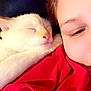 Simba is registered to the contest to win money with this photo: cat, white_cat, sleeping, person, face, smiling, red_blanket, cozy, closeup, nap, indoor, comfort, resting, fur, cute, pet, human, warm, relaxation, soft_light