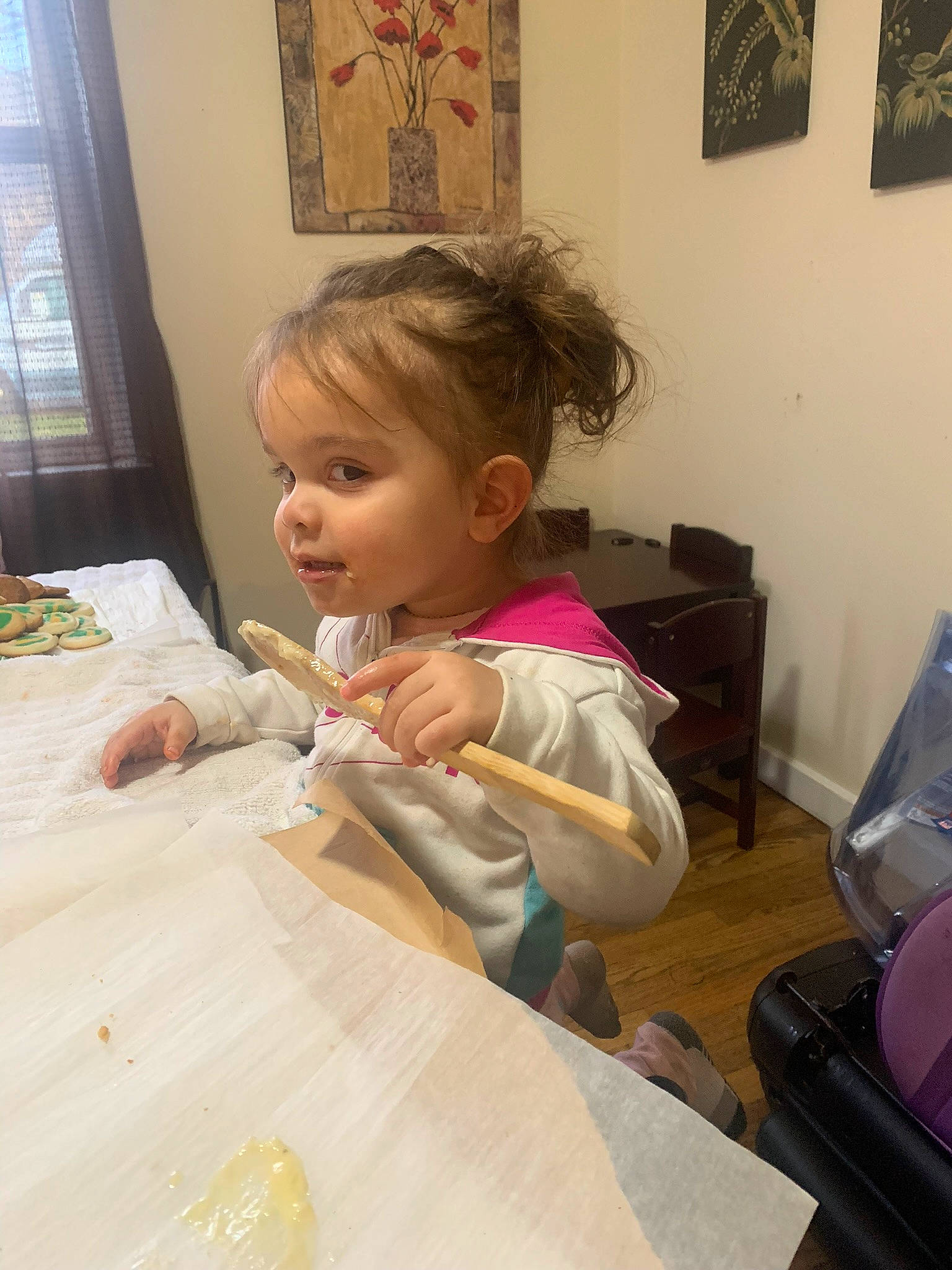 Jayliana is registered to the contest to win money with this photo: art, baby, chair, child, comfort_food, curtain, eating, event, flooring, fun, furniture, linens, person, picture_frame, plate, room, sitting, table, tableware, toddler