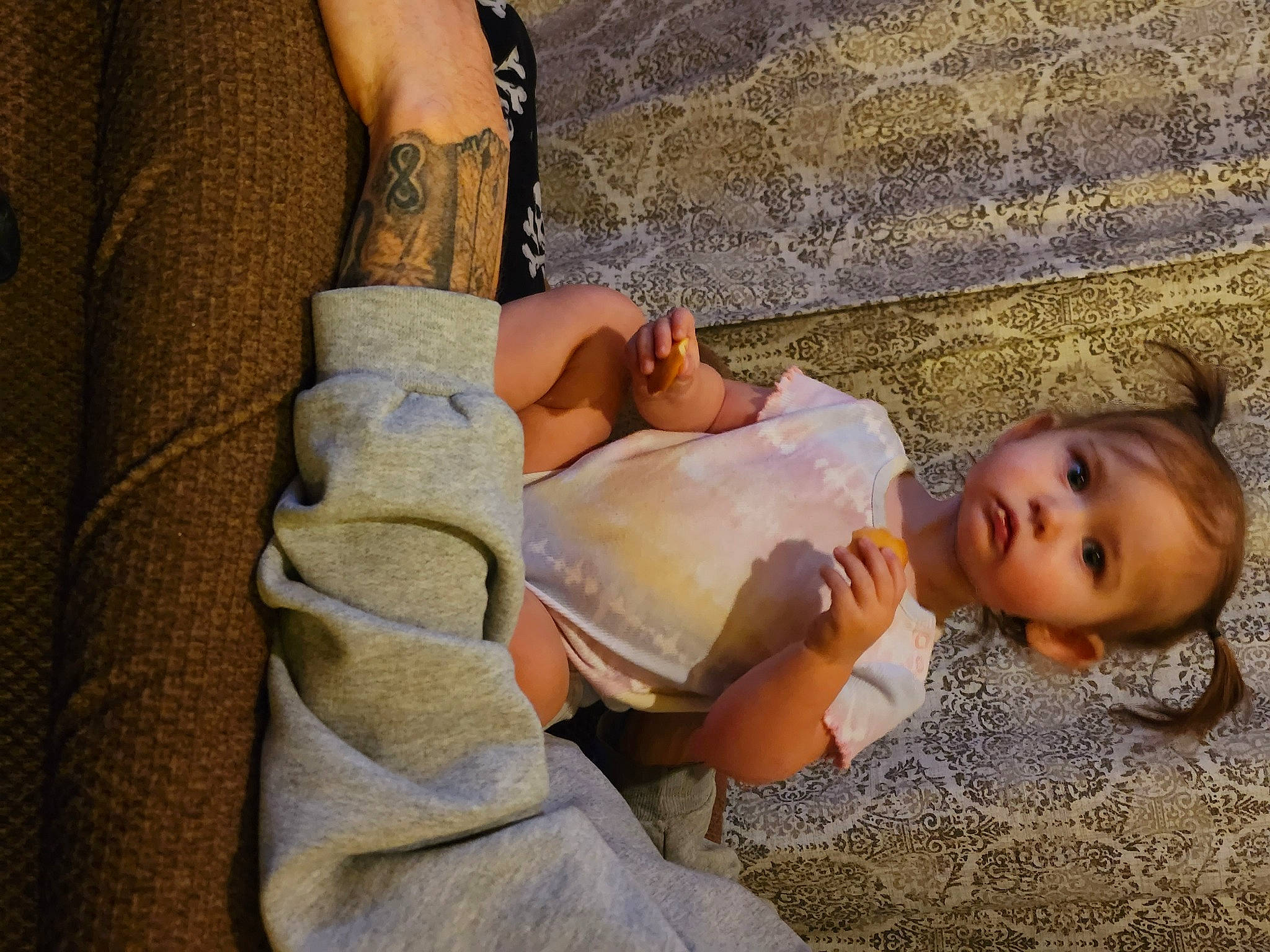 Annabelle is registered to the contest to win money with this photo: abdomen, chest, child, comfort, dress, elbow, eye, eyelash, gesture, happy, head, human_body, human_leg, joint, person, skin, thigh, toddler, trunk, wood