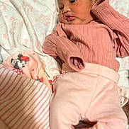 Dakota joined the competition — help win amazing prizes! baby, blanket, child, cozy, cute, cute_expression, fabric, indoors, infant, lying_down, minnie_mouse, newborn, pink_clothing, portrait, pout, resting, sleepwear, small_hands, soft_texture, striped_socks