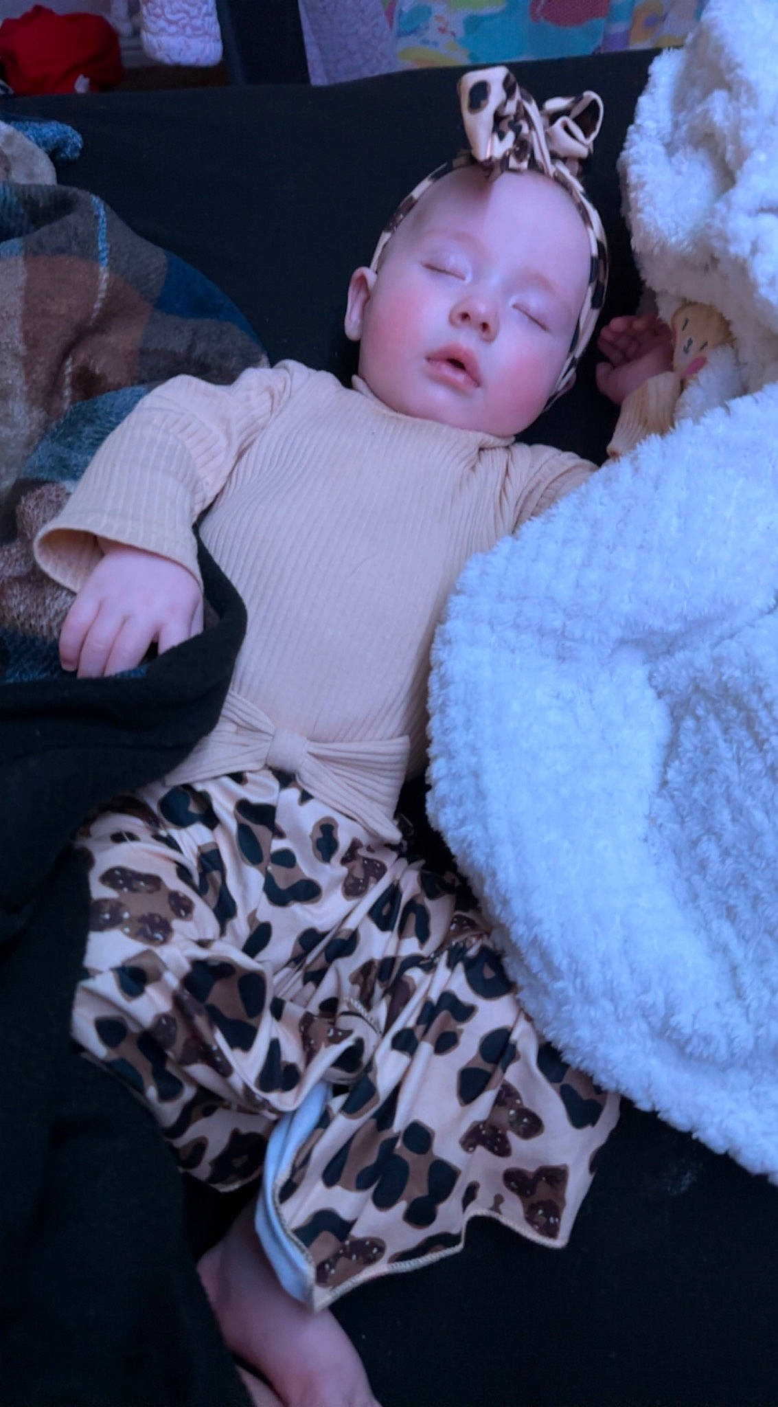 Aston is registered to the contest to win money with this photo: baby, baby_toddler_clothing, child, comfort, fashion_accessory, flash_photography, fun, fur, grass, happy, head, magenta, pattern, person, pink, sitting, skin, sleeve, toddler, winter