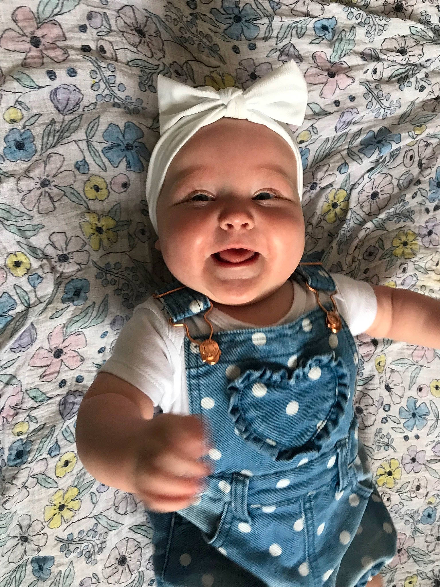 Isobel joined the competition — help win amazing prizes! arm, baby, baby_toddler_clothing, child, eye, fun, gesture, grass, happy, head, headwear, mouth, pattern, people_in_nature, person, pink, purple, skin, sleeve, t_shirt