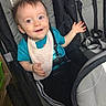 Jasper joined the competition — help win amazing prizes! baby, child, stroller, smiling, happy, waving, portrait, indoor, seated, infant, blue_shirt, bib, brown_hair, face, eyes, harness, baby_gear, carriage, photography, warning_label