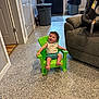 Jett joined the competition — help win amazing prizes! toddler, child, green_chair, indoor, smiling, happy, plastic_chair, floor, door, trash_can, couch, car_seat, clothing, person, home, footwear, wall, mat, light_switch, furniture