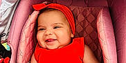 Israa a rejoint le concours — aidez-le/la à gagner de superbes lots ! baby, baby_accessories, baby_clothing, bracelet, child, closeup, comfort, cute, face, hand, happy, headband, infant, infant_girl, pink_stroller, portrait, red_dress, seat, skin, smiling