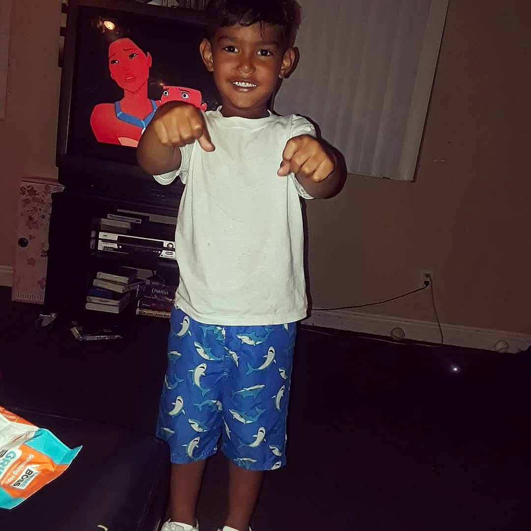 Ezra Dion is registered to the contest to win money with this photo: arm, child, cool, face, fun, happy, head, joint, joy, muscle, person, play, shoe, shoulder, smile, square, standing, t_shirt, toddler, top