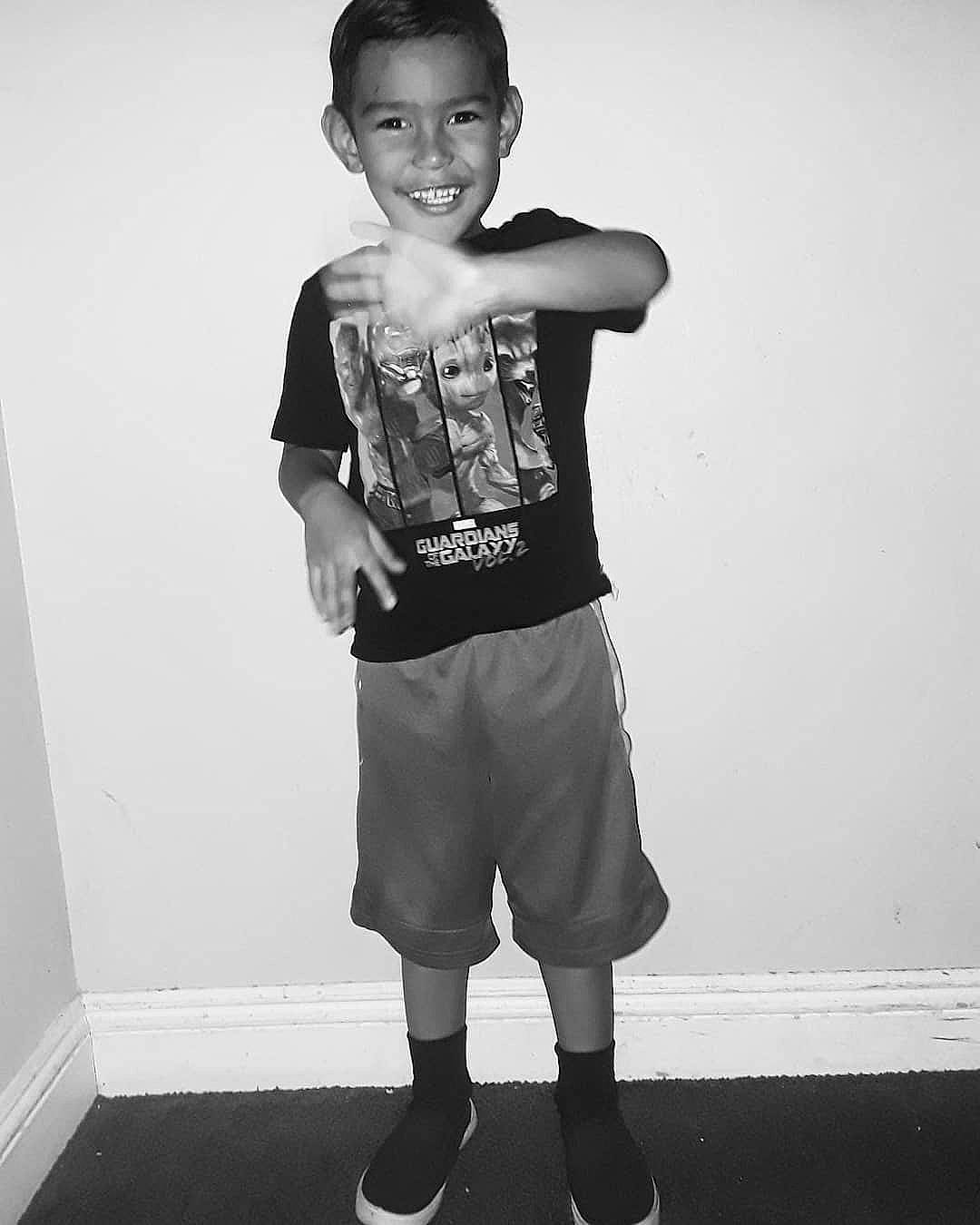 Ezra Dion joined the competition — help win amazing prizes! arm, black, black_and_white, child, child_model, footwear, head, joint, joy, knee, leg, outerwear, person, photography, shoe, shoulder, sleeve, standing, style, t_shirt