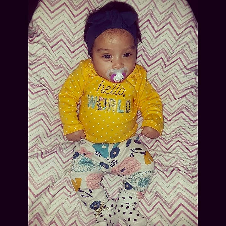 Elia Marie is registered to the contest to win money with this photo: baby, baby_products, baby_toddler_clothing, beauty, cheek, child, cool, face, forehead, head, outerwear, person, product, sleeve, smile, t_shirt, textile, toddler, yellow