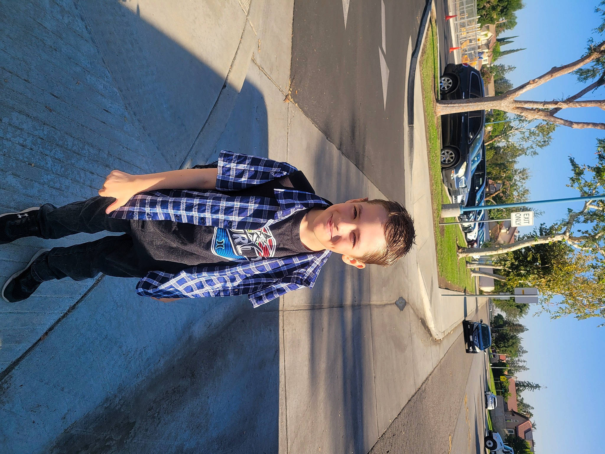 Joshua is registered to the contest to win money with this photo: blue, concrete, electric_blue, eyewear, facade, fun, joy, leisure, pattern, pedestrian, person, pole, recreation, reflection, shadow, sky, tints_and_shades, tree, water, world