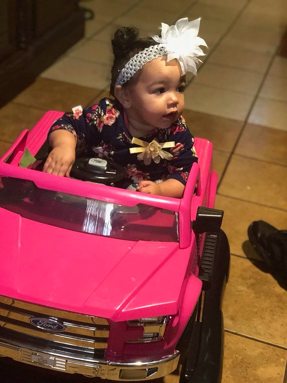 Amaria is registered to the contest to win money with this photo: automotive_design, car, child, child_model, city_car, costume, family_car, headgear, hood, magenta, performance, person, pink, sport_utility_vehicle, vehicle