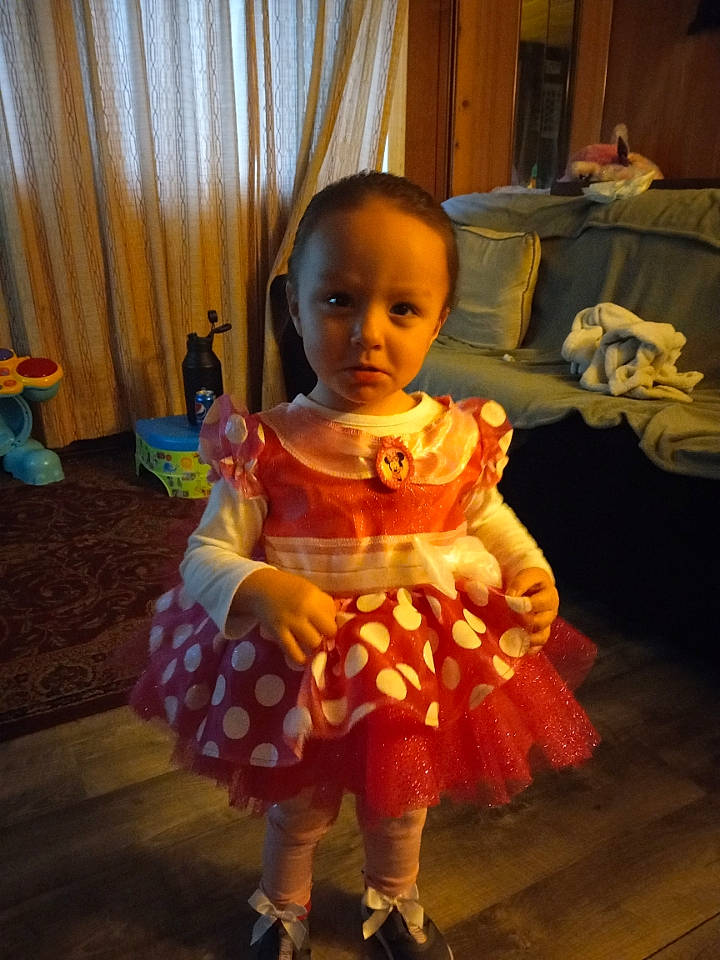 Amirra is registered to the contest to win money with this photo: baby, baby_toddler_clothing, child, costume, curtain, day_dress, dress, event, flooring, fun, hardwood, human_leg, magenta, pattern, peach, person, room, sandal, sitting, toddler