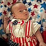 american_flag, baby, blanket, blue, bow_tie, clothing, cute, fabric, face, hand, infant, lying_down, newborn, pattern, portrait, red, soft, stars, stripes, white