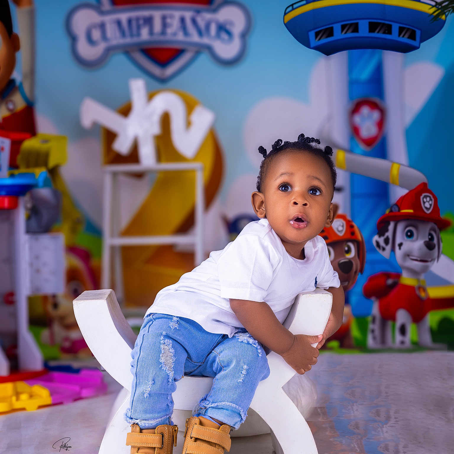 Dariel is registered to the contest to win money with this photo: baby, bathroom, bodypart, boy, child, clothing, face, footwear, head, indoors, jeans, male, pants, person, photography, portrait, room, shoe, sitting, toilet