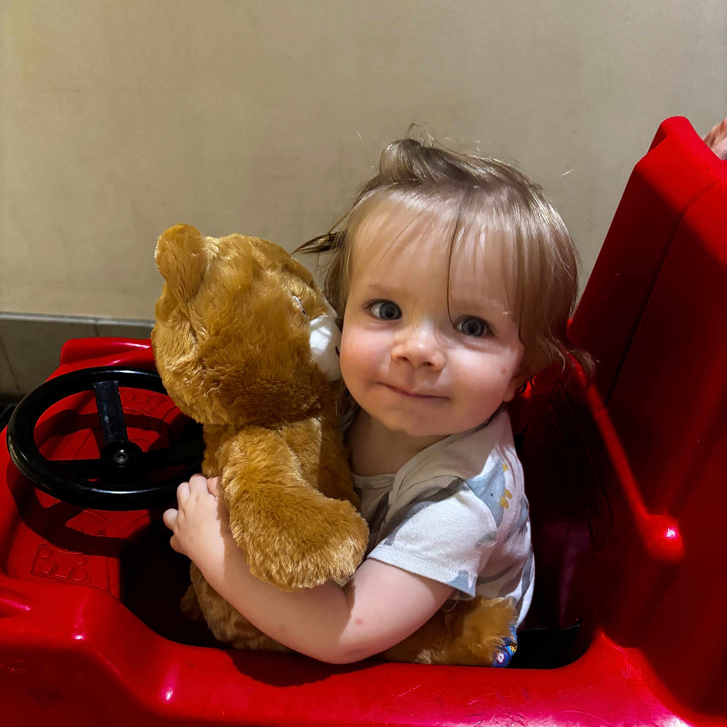 Evan joined the competition — help win amazing prizes! child, childhood, comfort, cute, eyes, face, fun, hair, hug, indoor, person, play, plush_toy, red, seat, short_sleeve_shirt, smile, teddy_bear, toddler, toy_car
