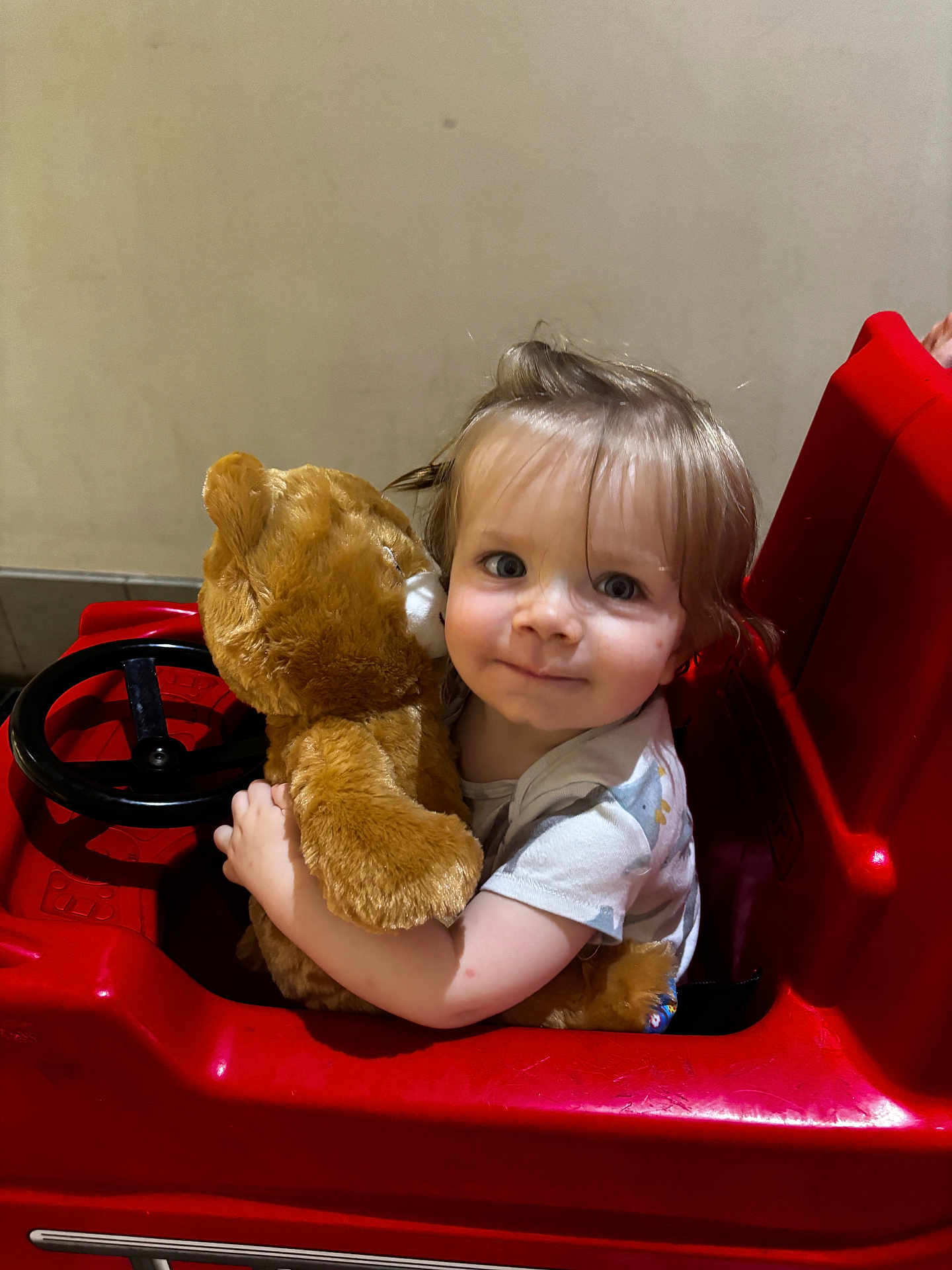Evan joined the competition — help win amazing prizes! child, childhood, comfort, cute, eyes, face, fun, hair, hug, indoor, person, play, plush_toy, red, seat, short_sleeve_shirt, smile, teddy_bear, toddler, toy_car