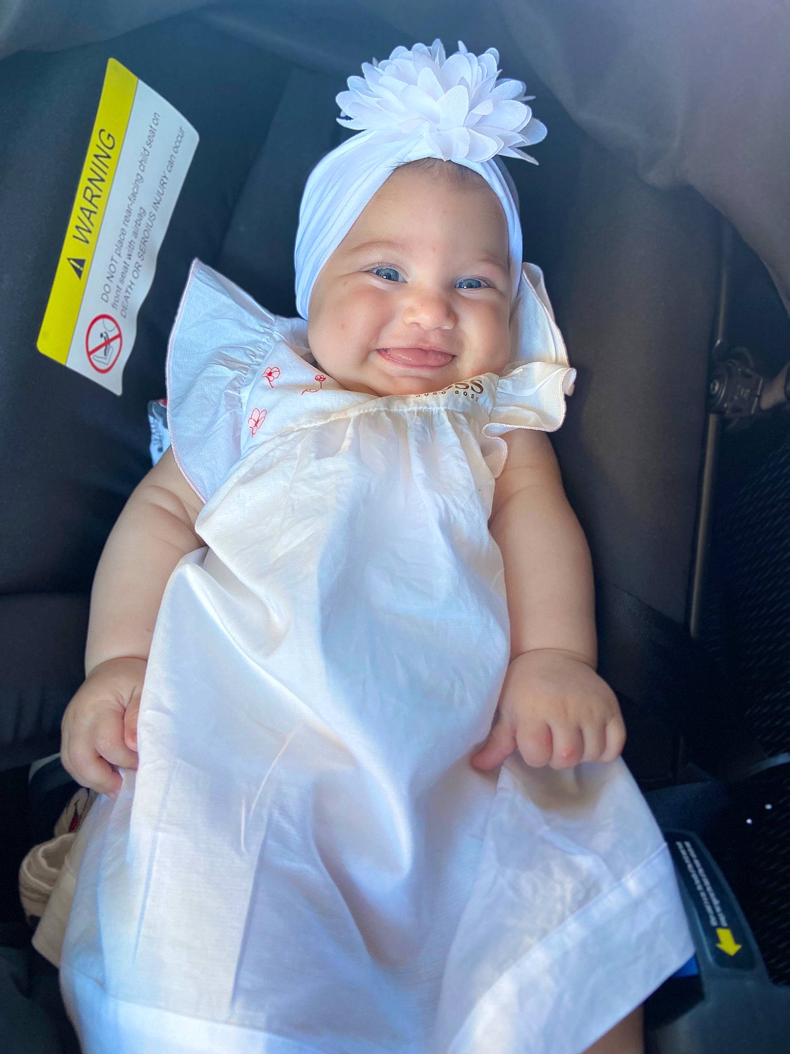 Ela participe au concours pour gagner de l'argent avec cette photo : baby, baby_toddler_clothing, bridal_accessory, child, dress, electric_blue, event, finger, flash_photography, gesture, happy, headband, headgear, headpiece, headwear, joy, person, pink, product, skin