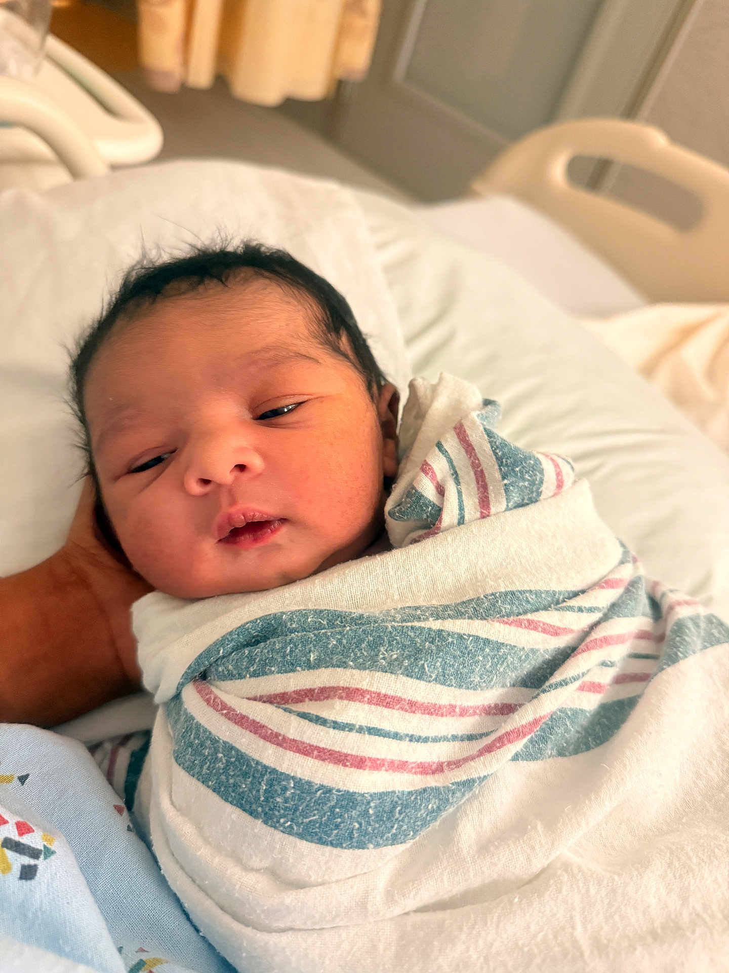 Aali joined the competition — help win amazing prizes! newborn, baby, infant, wrapped, blanket, hospital, bed, hand, sleepy, resting, face, person, portrait, indoors, soft_light, cozy, cute, healthcare, parent, care