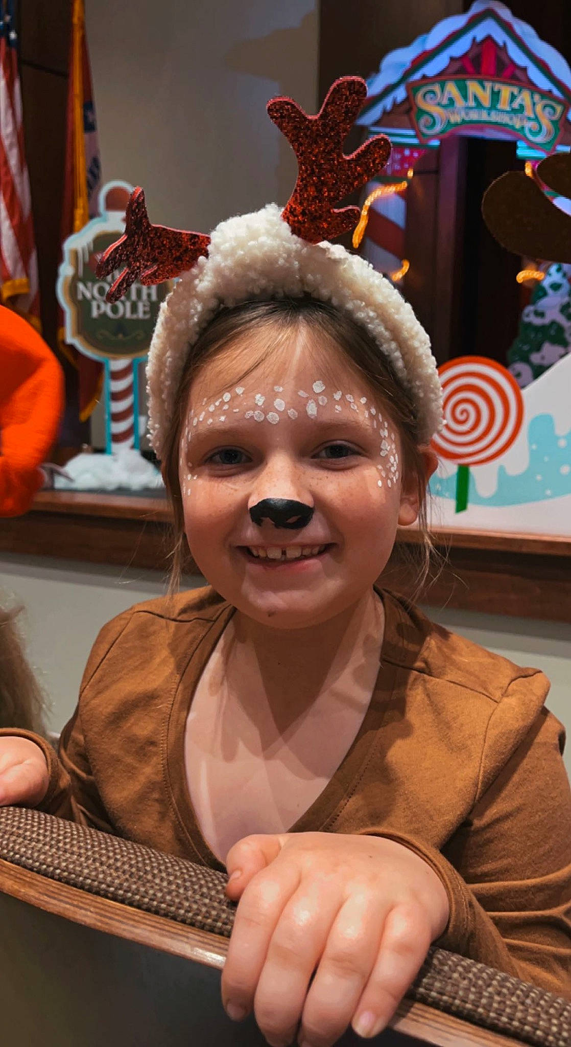 Charlee is registered to the contest to win money with this photo: child, christmas, costume, event, festival, fictional_character, fun, fur, happy, holiday, jewellery, joy, laugh, mammal, organ, people, person, photography, smile, snapshot