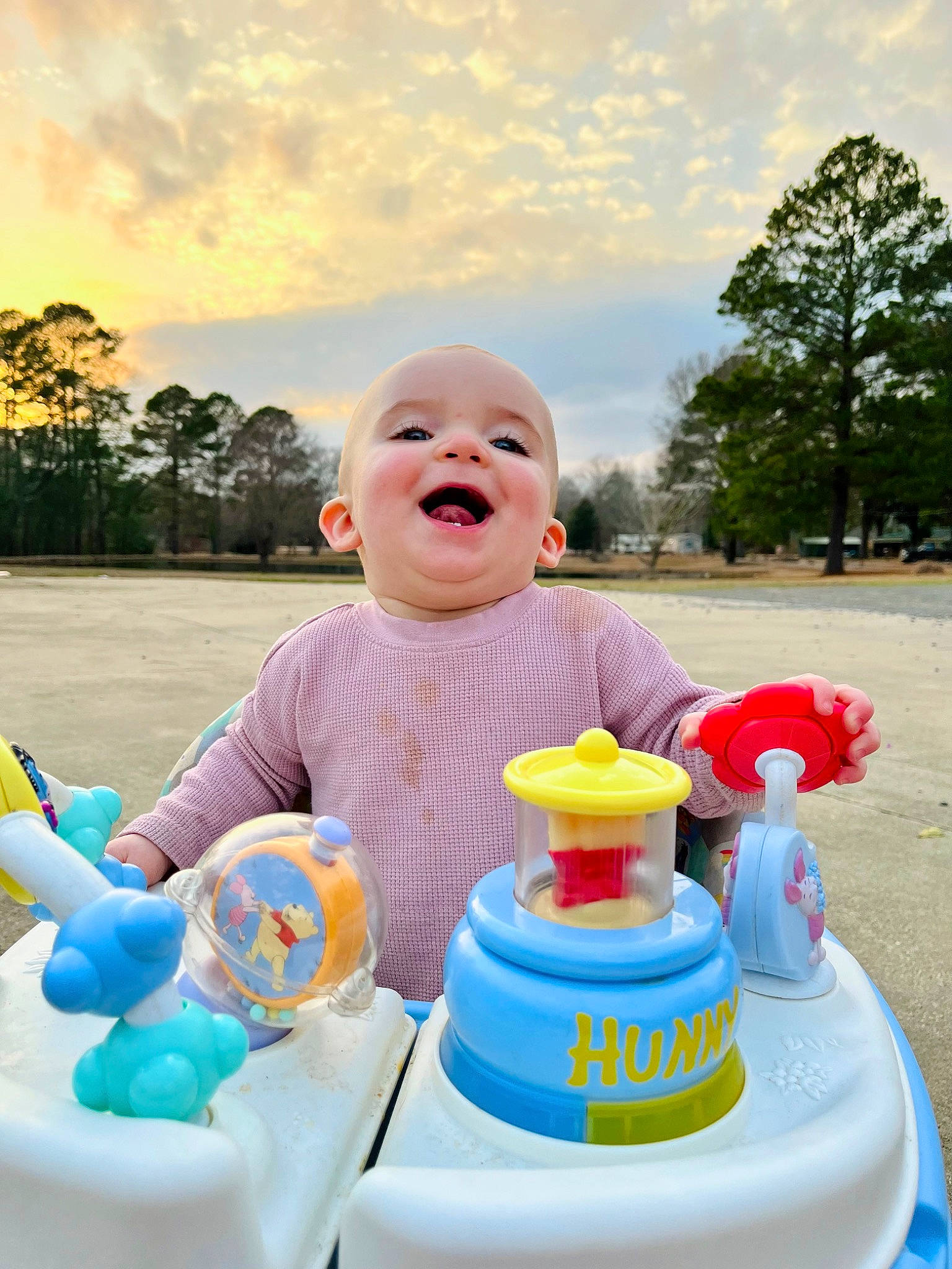 Maisyn joined the competition — help win amazing prizes! baby_products, child, cloud, event, fun, happy, leisure, person, pink, product, recreation, riding_toy, sitting, sky, smile, t_shirt, table, toddler, toy, tree