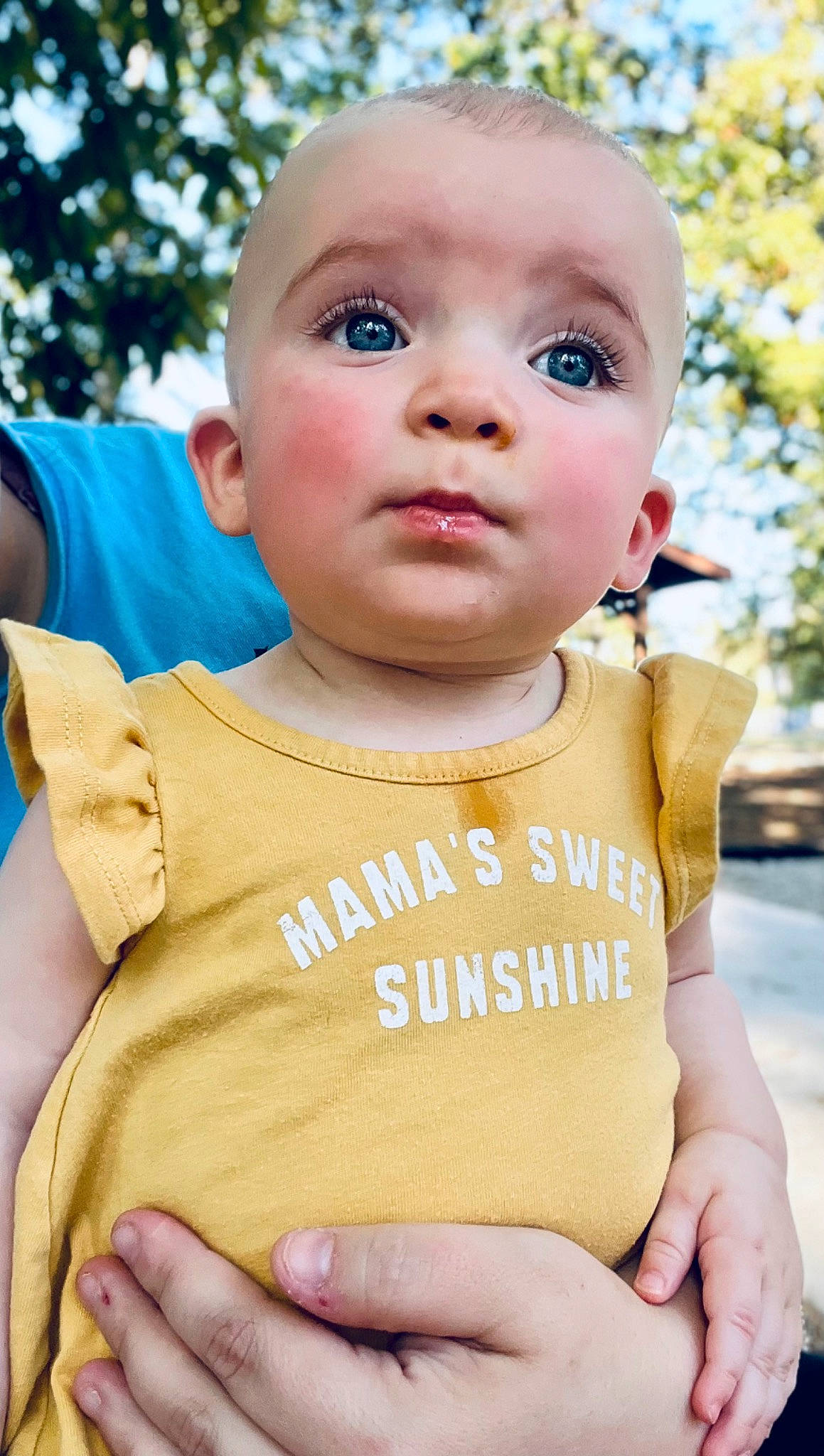Maisyn is registered to the contest to win money with this photo: baby, baby_toddler_clothing, cheek, child, face, finger, fun, gesture, grass, happy, head, leisure, lip, nose, person, skin, sleeve, summer, t_shirt, toddler