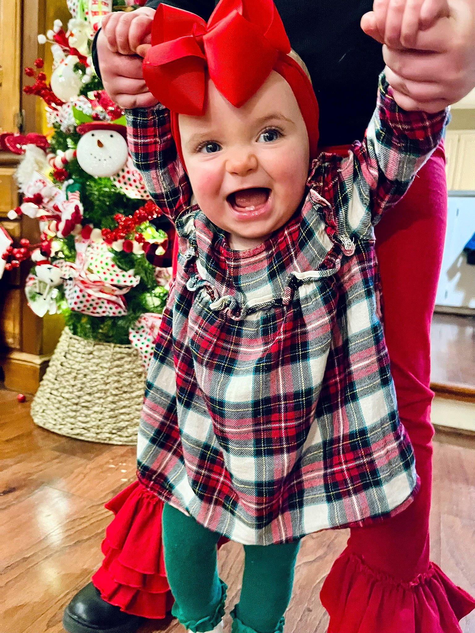 Maisyn joined the competition — help win amazing prizes! baby, baby_toddler_clothing, christmas, christmas_eve, event, fictional_character, fun, gesture, happy, hat, headwear, holiday, pattern, people, person, plaid, red, sleeve, smile, tartan