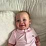 Victoire participe au concours pour gagner de l'argent avec cette photo : baby, child, comfort, couch, cushion, cute, face, happy, indoor, infant, person, pink_clothing, polo_shirt, portrait, relaxation, sitting, smile, soft_lighting, texture, young_child
