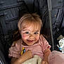 Harlo is registered to the contest to win money with this photo: child, toddler, smiling, blue_eyes, pink_dress, blanket, pacifier, stroller, happy, cute, baby, portrait, clothing, infant, person, young_child, indoor, seat, face, hands